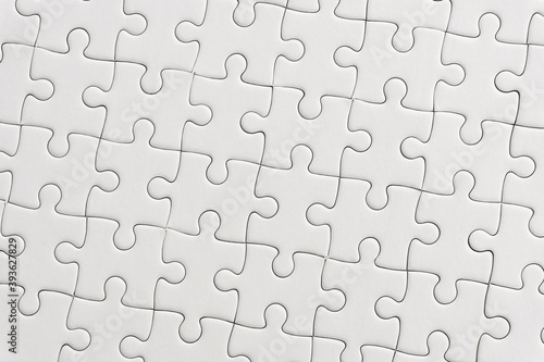 White jigsaw puzzle pattern background..