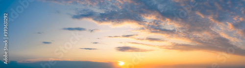 Wide Panoramic Blue Orange sky with Bright yellow summer sun and Stratocumulus clouds in Morning