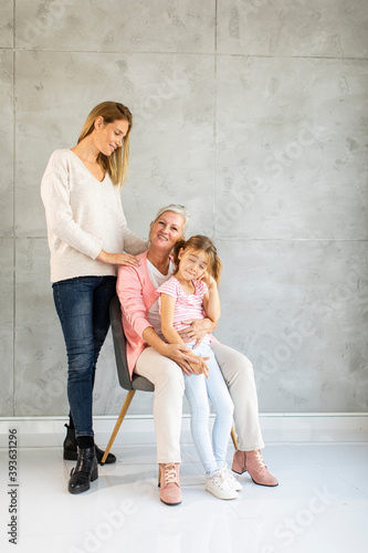 Senior woman, adult woman and little girl, three generations at home