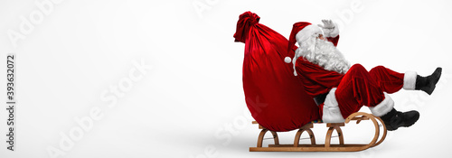 Canvas Print Santa Claus On His Sledge With A Bag Full Of Christmas Gifts