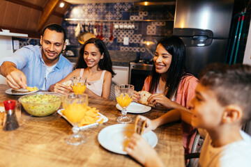 Latin family having dinner at home