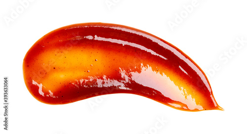Smear of barbecue sauce or ketchup isolated on white background, close up. photo
