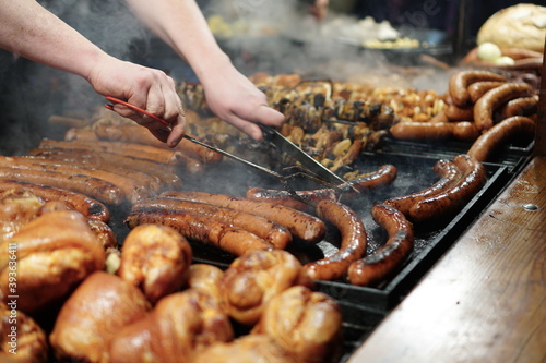 Food booth selling traditional Polish street food at a Christmas Market stall in Krakow, Poland. Traditional Polish street food in Cracow. 