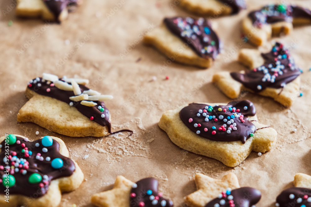 baked  christmas cookies with chocolate icing