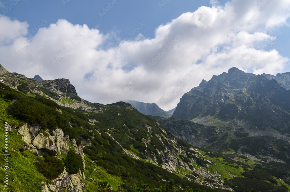 Foggy mountains landscape, hiking trail in Mengusovska valley, High Tatras (Vysoke Tatry), Slovakia
