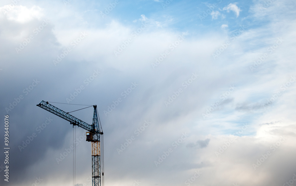 Construction banner. Crane in front of sunset sky. Building concept. Copy space Construction banner. Crane in front of sunset sky. Building concept. Copy space