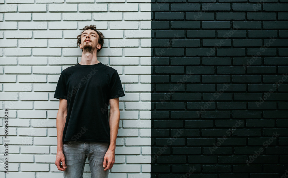 Young charismatic hipster guy wearing black blank t-shirt. Mock-up for print. T-shirt template. Young charismatic hipster guy wearing black blank t-shirt. Mock-up for print. T-shirt template.