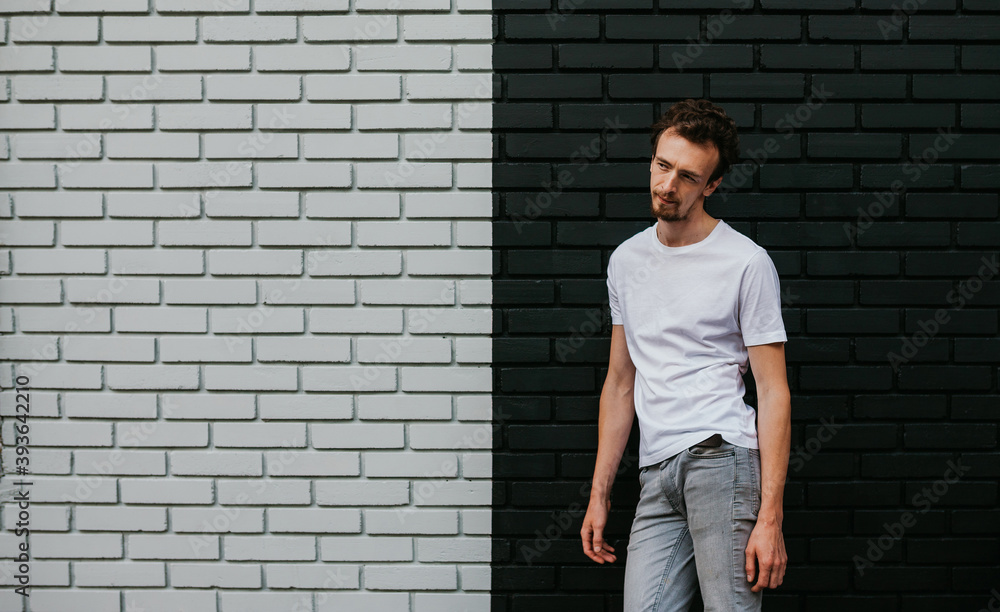 Young bearded hipster guy wearing white blank t-shirt. Mock-up for print. T-shirt template. Young bearded hipster guy wearing white blank t-shirt. Mock-up for print. T-shirt template.