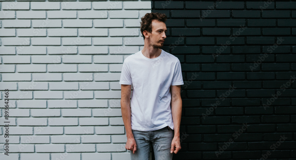 Young bearded hipster guy wearing white blank t-shirt. Mock-up for print. T-shirt template. Young bearded hipster guy wearing white blank t-shirt. Mock-up for print. T-shirt template.