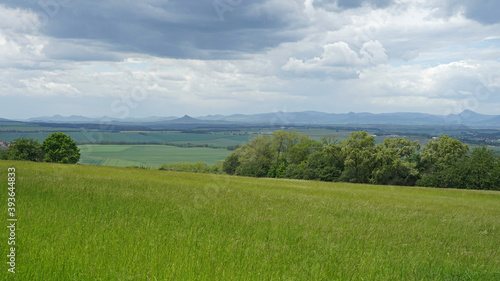 Czech Central Mountains (Ceske stredohori) with meadows and volcanoes hills panoramic view