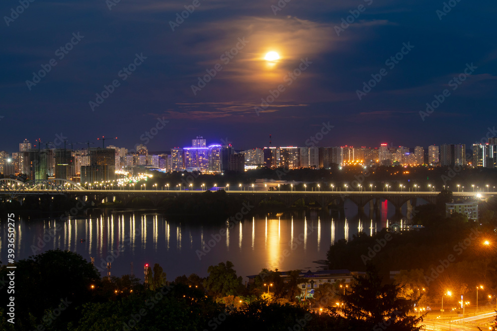 Evening view of Kiev, Ukraine, a view of the Paton Bridge and the left bank.