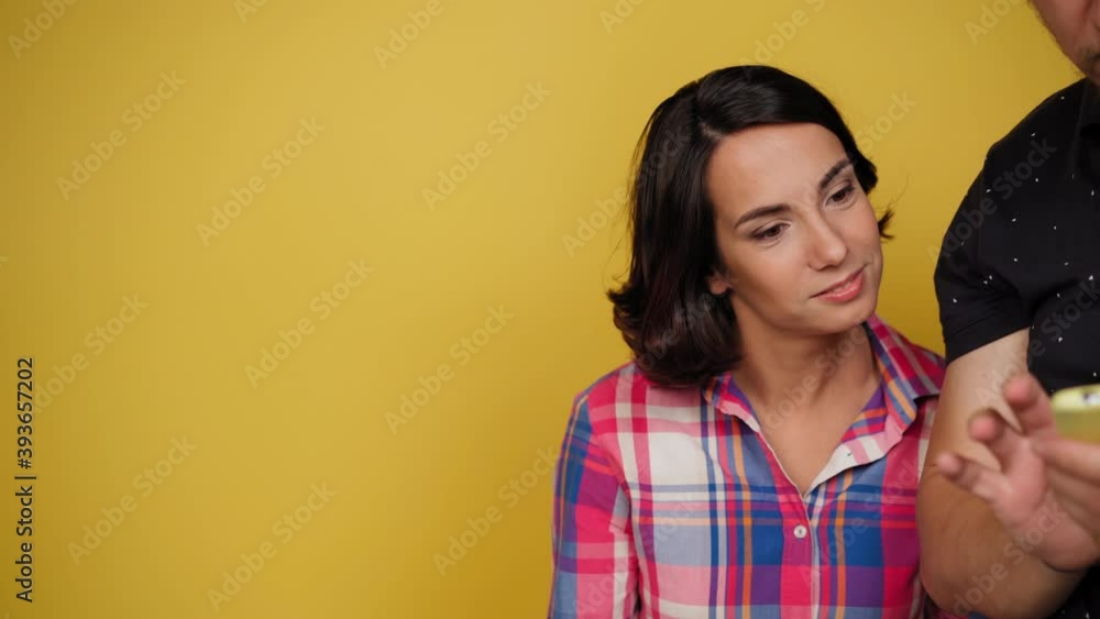 Photographer showing client referenced images on smartphone. Charming woman looking at smartphone. Facial expressions, emotions, feelings.High quality 4k resolution footage. Photographer showing client referenced images on smartphone. Charming woman looking at smartphone. Facial expressions, emotions, feelings.High quality 4k resolution footage.