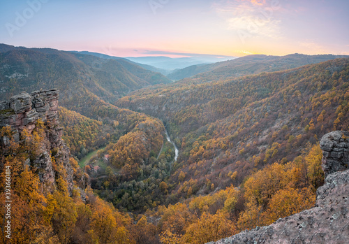 Amazing panoramic view from Tumba vantage point on a canyon with meandering river Temstica, autumn colored trees and a rocky summit