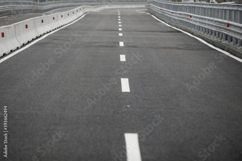 Shallow depth of field (selective focus) image with an empty highway.