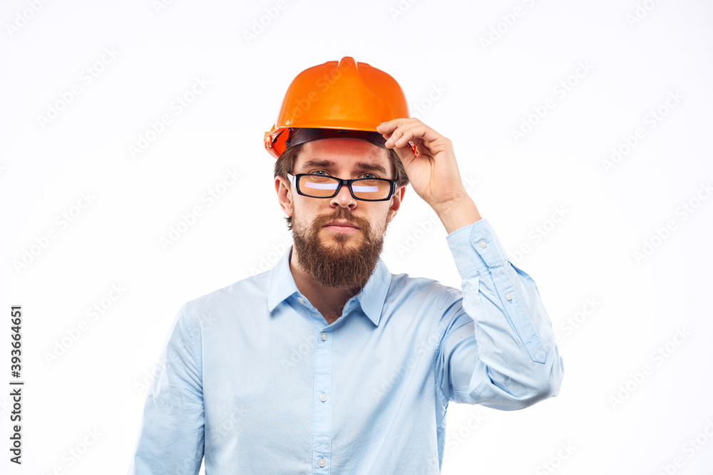 Business man in orange helmet shirt construction security professionals Business man in orange helmet shirt construction security professionals