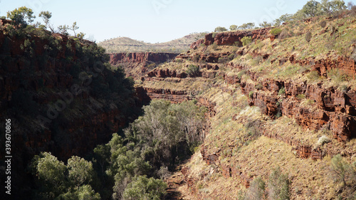 Arid dry red rock landscapes at Dales Gorge within Karijini National Park in the Hamersley Range of Western Australia.