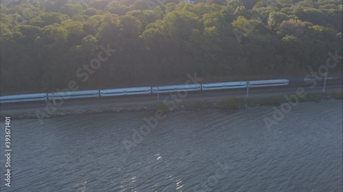 Aerial Drone Shot Tracking Train Approaching New York City Along Hudson River