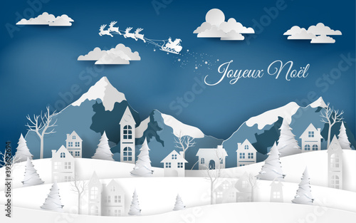 carte ocarte ou bandeau sur Joyeux Noël en blanc avec des montagnes et un village en bleu et blanc et un ciel bleu en dégradé avec des nuages et le traineau du père Noël en blanc