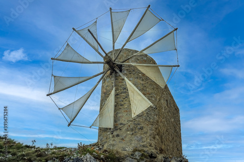 Beautiful jib sail windmills, used to pump water in arid zones, particularly found all around the Lassithi Plateau on the Island of Crete, Greece