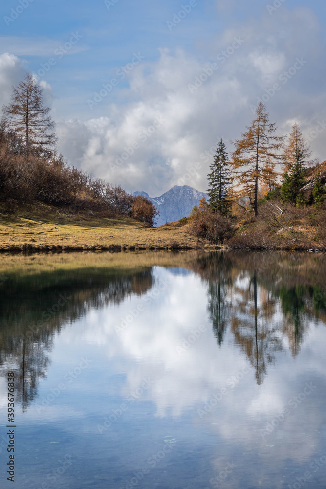 Symmetrical reflections in Lake Spigorel in autumnal guise - Orobie - Italian Alps