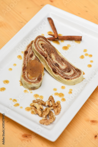 Walnut bread roll on wooden background photo