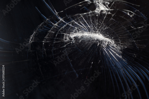 Broken smartphone screen with cracks from impact. © Alex