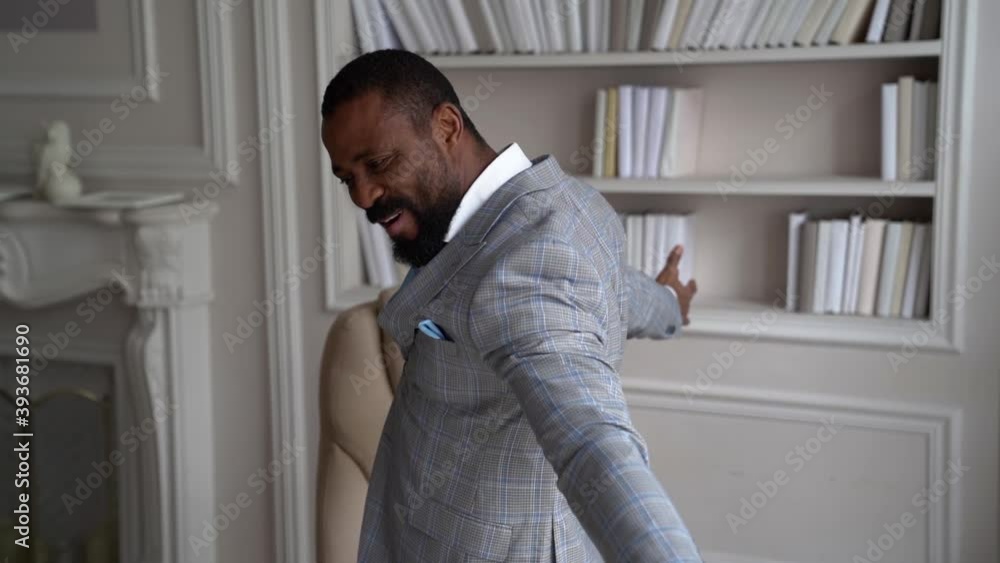 happy and joyful businessman is rejoicing by win in business, good deal and large profit, standing in office happy and joyful businessman is rejoicing by win in business, good deal and large profit, standing in office