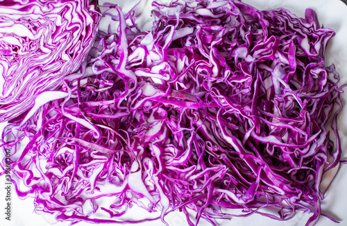 chopped purple cabbage on a cutting board