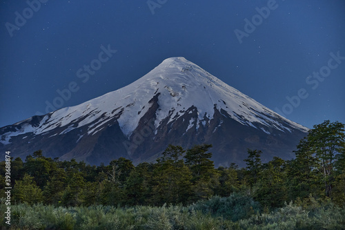 Snow capped Osorno Volcano at night under the star sky  Patagonia  Chile  South America