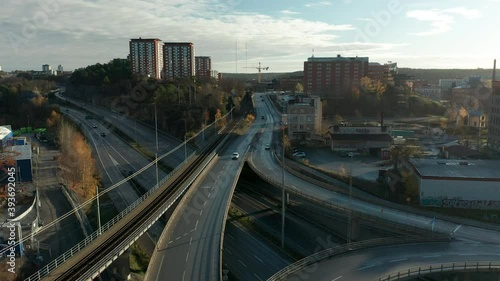 Highway running through city urban environment, aeria lview of intersection, 4k photo