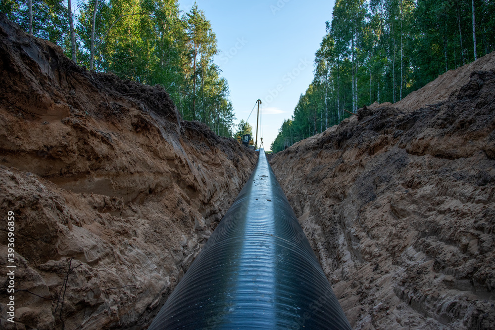 Crude oil and Natural gas pipeline construction work in forest area ...