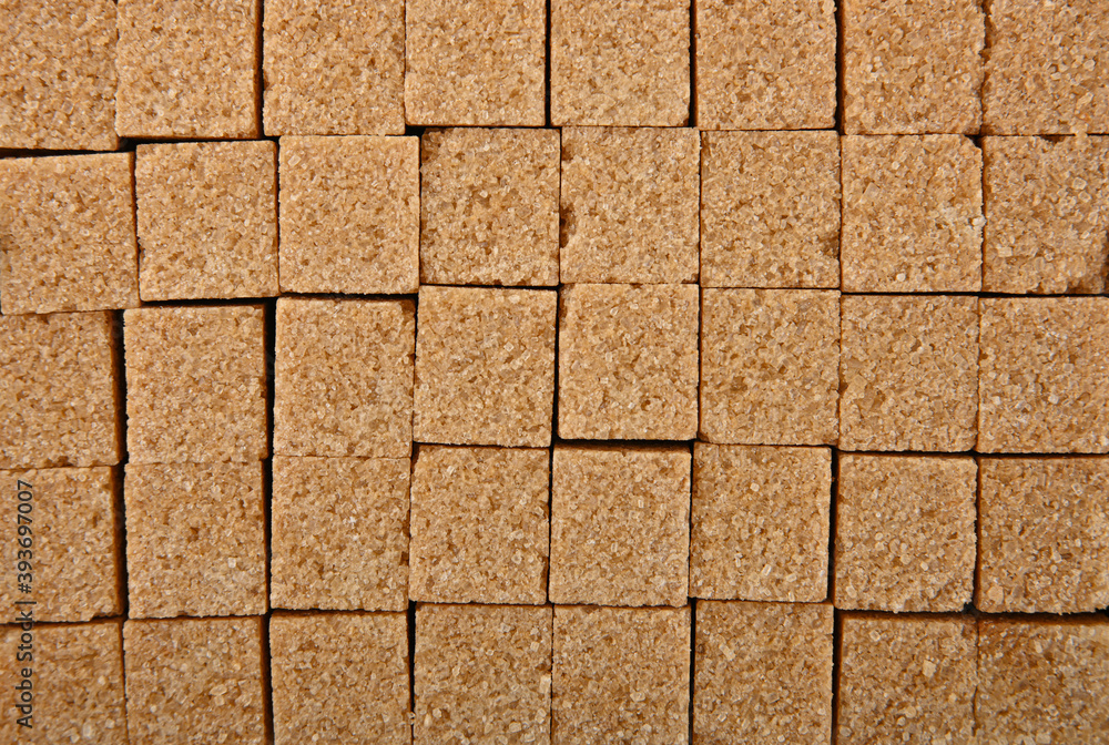 Obraz premium Background texture pattern of brown sugar cubes