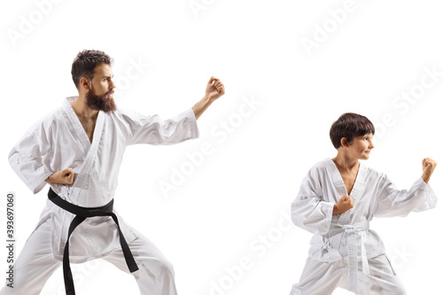 Karate boy and man in kimonos practicing