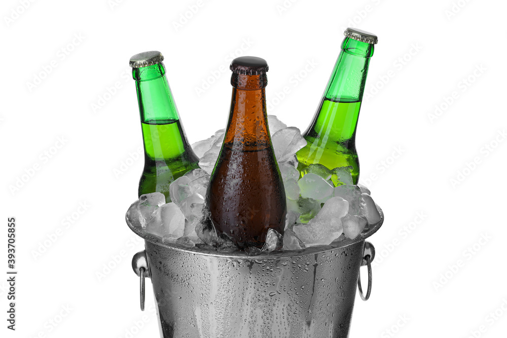 Metal bucket with bottles of beer and ice cubes isolated on white Metal bucket with bottles of beer and ice cubes isolated on white