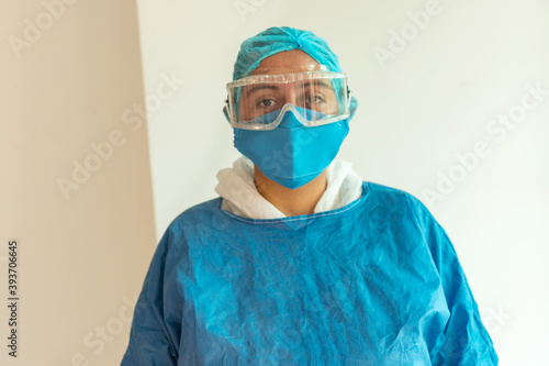 Portrait of a doctor wearing a medical mask and looking at the camera
