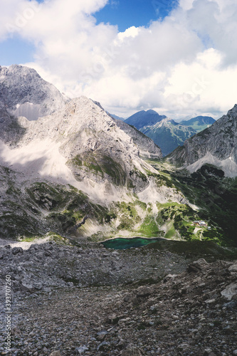 Experience the breathtaking beauty of the high alpine mountain landscape of the Zugspitze area in the Alps, with its stunning peaks and tranquil atmosphere. Perfect for outdoor activities and nature