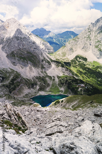 Experience the breathtaking beauty of the high alpine mountain landscape of the Zugspitze area in the Alps, with its stunning peaks and tranquil atmosphere. Perfect for outdoor activities and nature