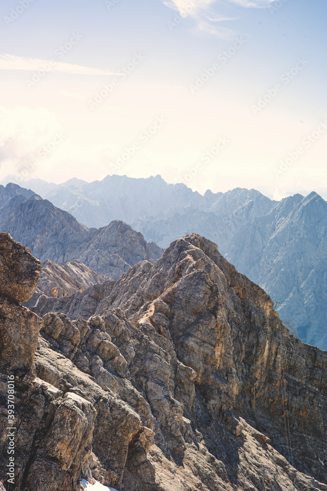Experience the breathtaking beauty of the high alpine mountain landscape of the Zugspitze area in the Alps, with its stunning peaks and tranquil atmosphere. Perfect for outdoor activities and nature