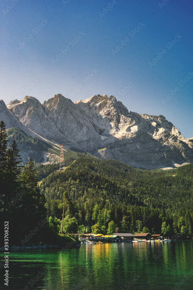 Picturesque mountain landscapes in summer, inviting for hiking with views of the highest peaks of the Alps. Mountain sports enthusiasts and hikers immediately have wanderlust