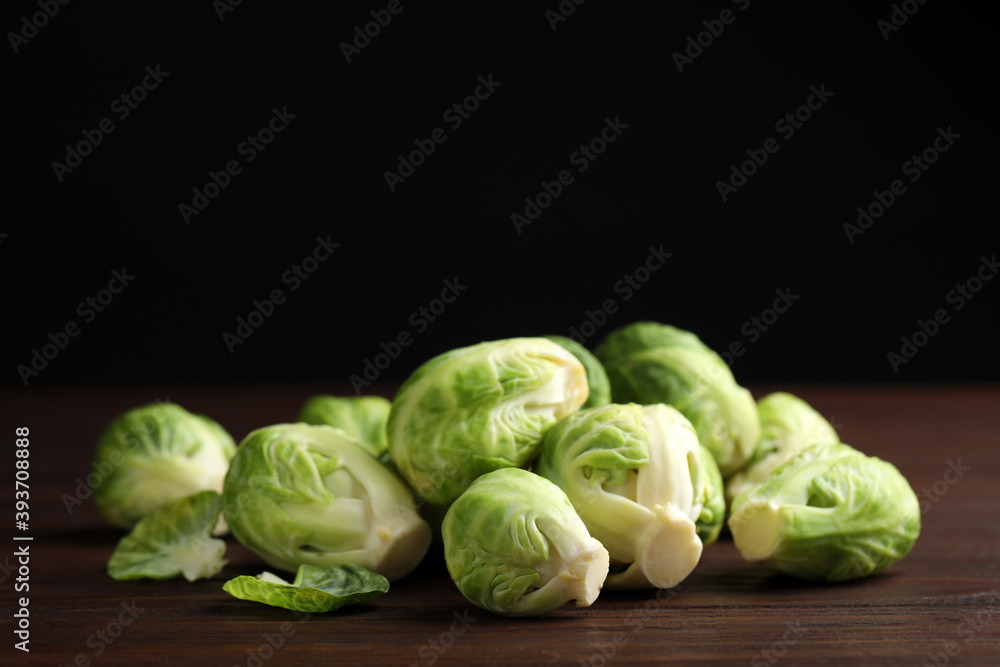 Fresh Brussels sprouts on brown wooden table, closeup Fresh Brussels sprouts on brown wooden table, closeup