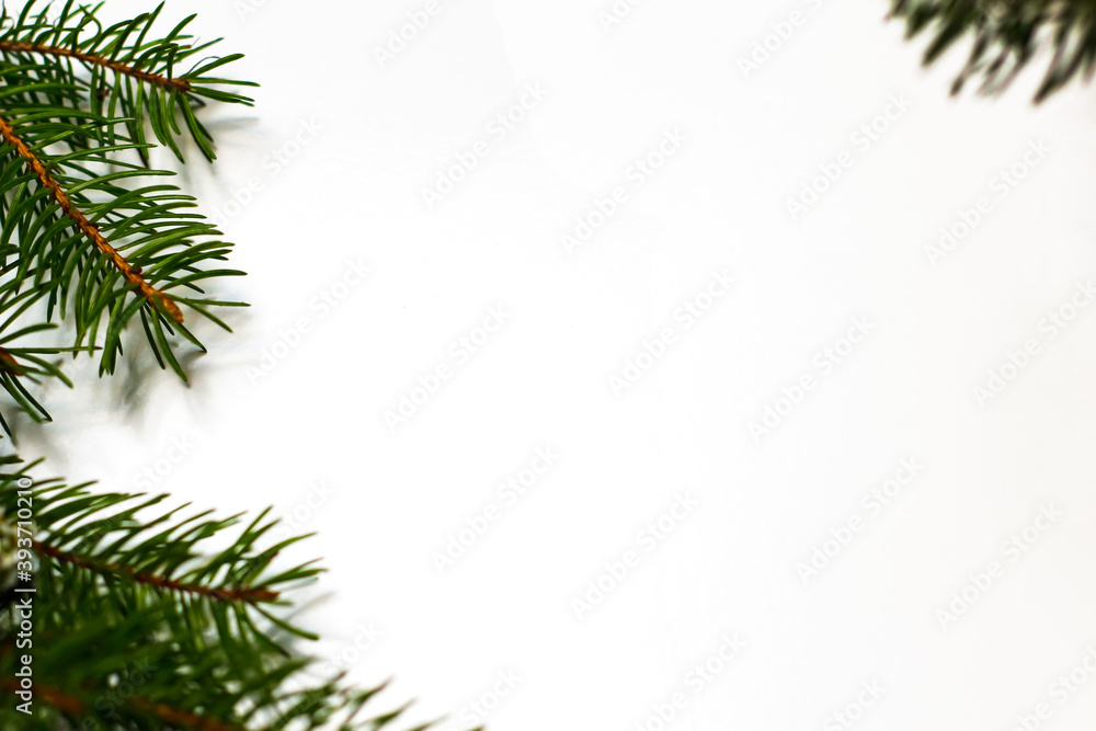 New Year's background. Spruce branches on a white table. Ornaments for the New Year tree. Christmas concept. Selective focus New Year's background. Spruce branches on a white table. Ornaments for the New Year tree. Christmas concept. Selective focus