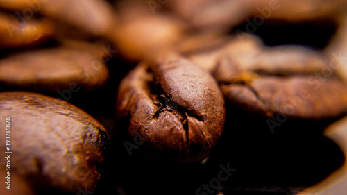 Coffee beans freshly roasted in close up - food photography