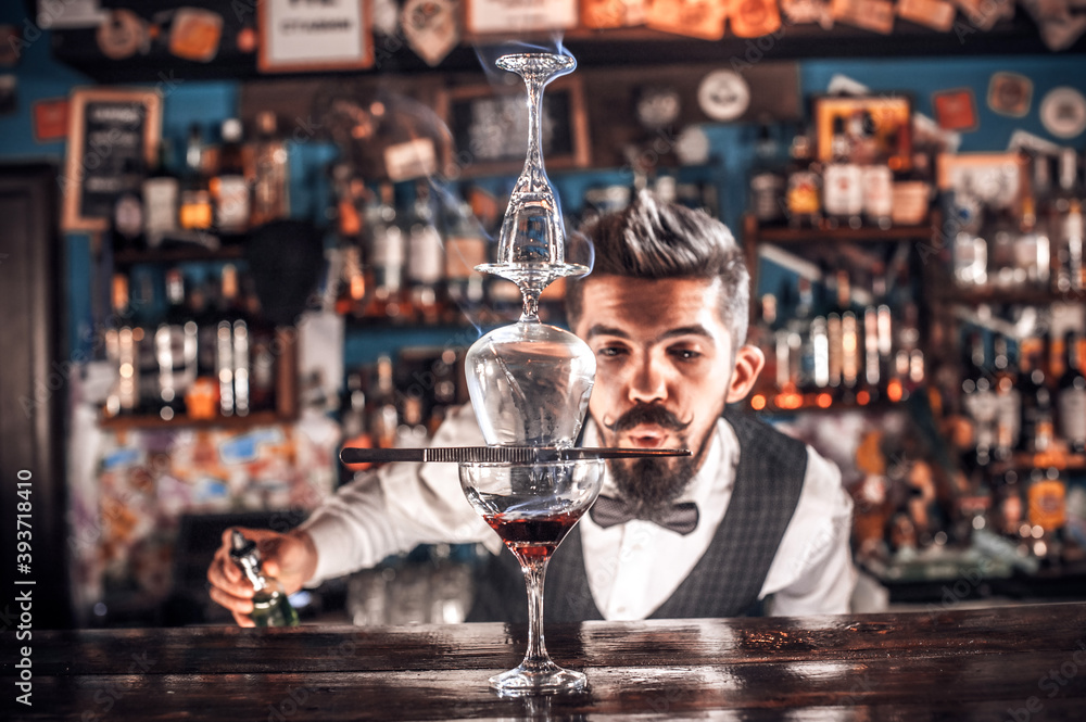 Bartender mixes a cocktail on the alehouse