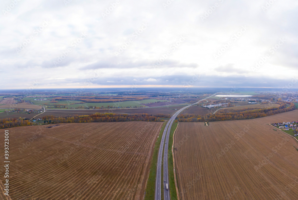 Aerial bird-eye view on freeway in autumn season