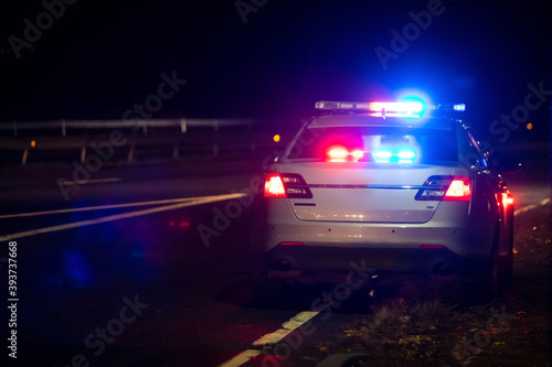 Police emergency flash lights at night from the back