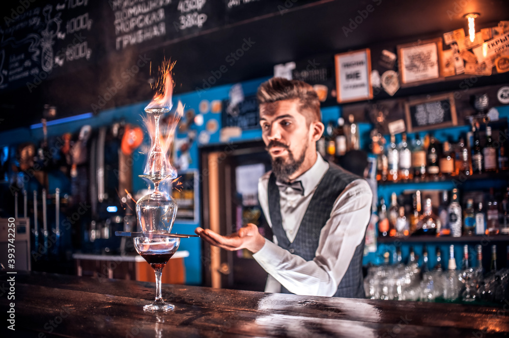 Bartender concocts a cocktail in the bar