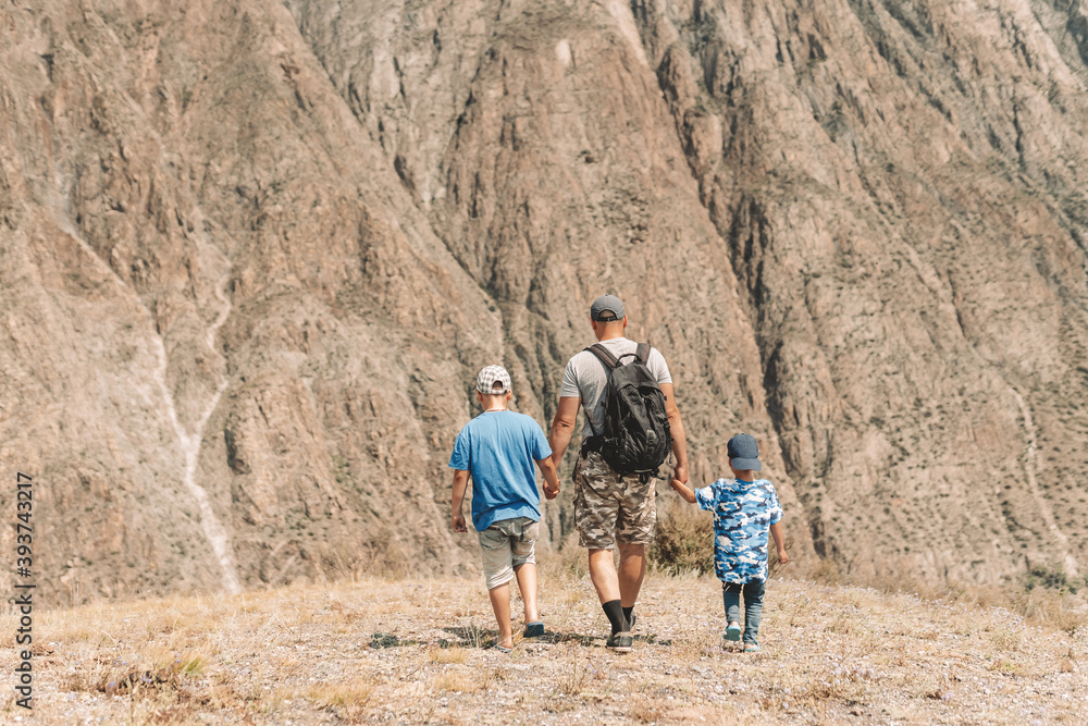 family walking in the mountains