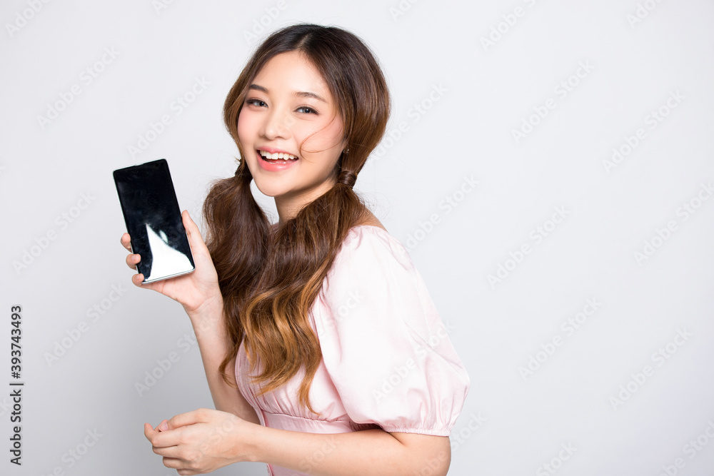 Portrait of young woman posing with smartphone Portrait of young woman posing with smartphone