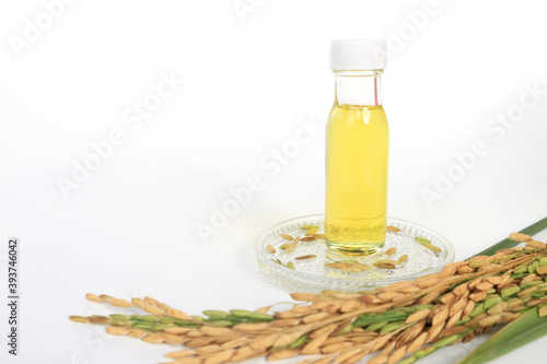 Rice bran oil in bottle glass on white background