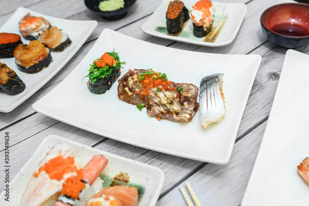 The sushi on the plate is a unique Japanese dish that looks delicious. The sushi on the plate is a unique Japanese dish that looks delicious.
